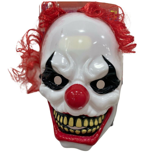 Mascara de payaso con pelo rojo